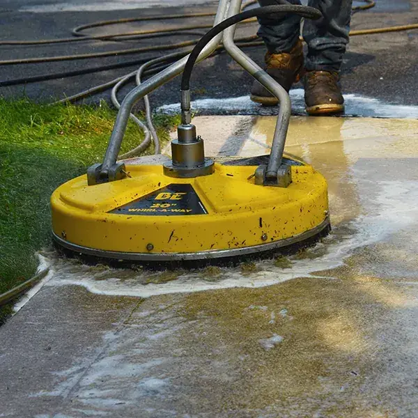 Clean concrete driveway after pressure washing